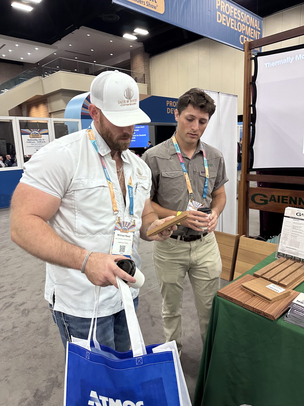 Michael Reed reviewing wood samples at the Gaiennie Lumber booth at the Sunbelt Builders Show